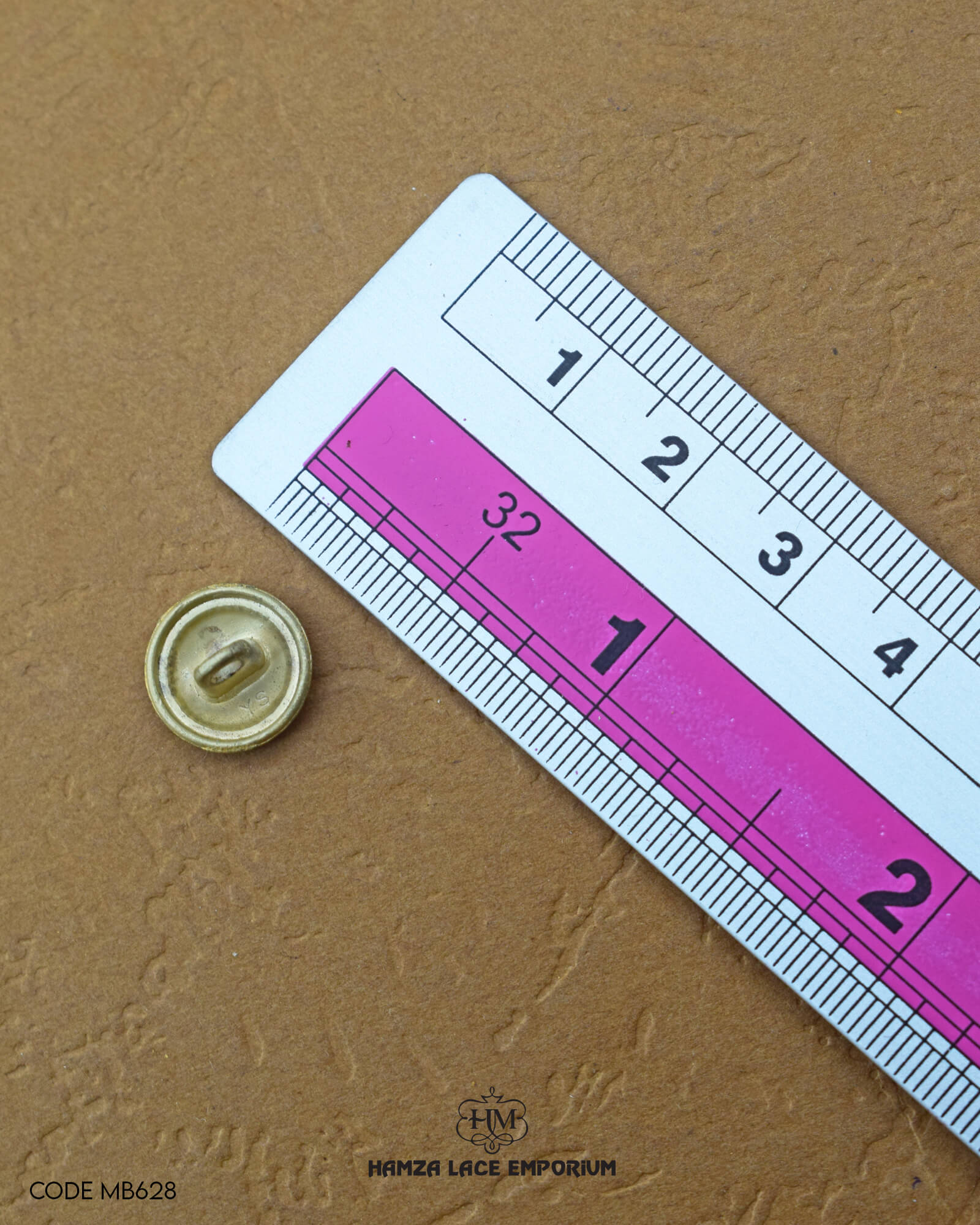 Size of the 'Golden Plane Metal Button MB628' is given with the help of a ruler
