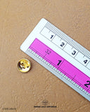 The dimensions of the 'Metal Suiting Button MB632' are determined using a ruler.