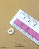 The dimensions of the 'Flower Design Button MB663' are determined using a ruler.