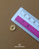 The dimensions of the 'Silver Metal Button MB67' are determined using a ruler.