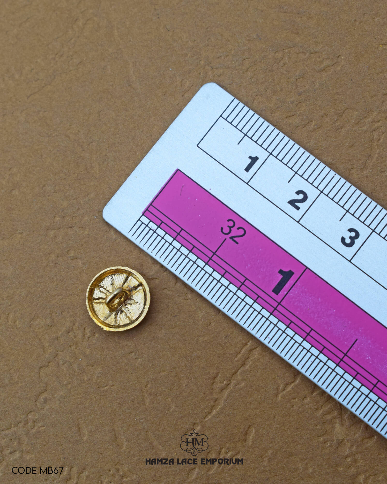 The size of the 'Golden Metal Button MB67' is measured by using a ruler