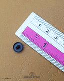 The dimensions of the 'Metal Suiting Button MB670' are determined using a ruler.