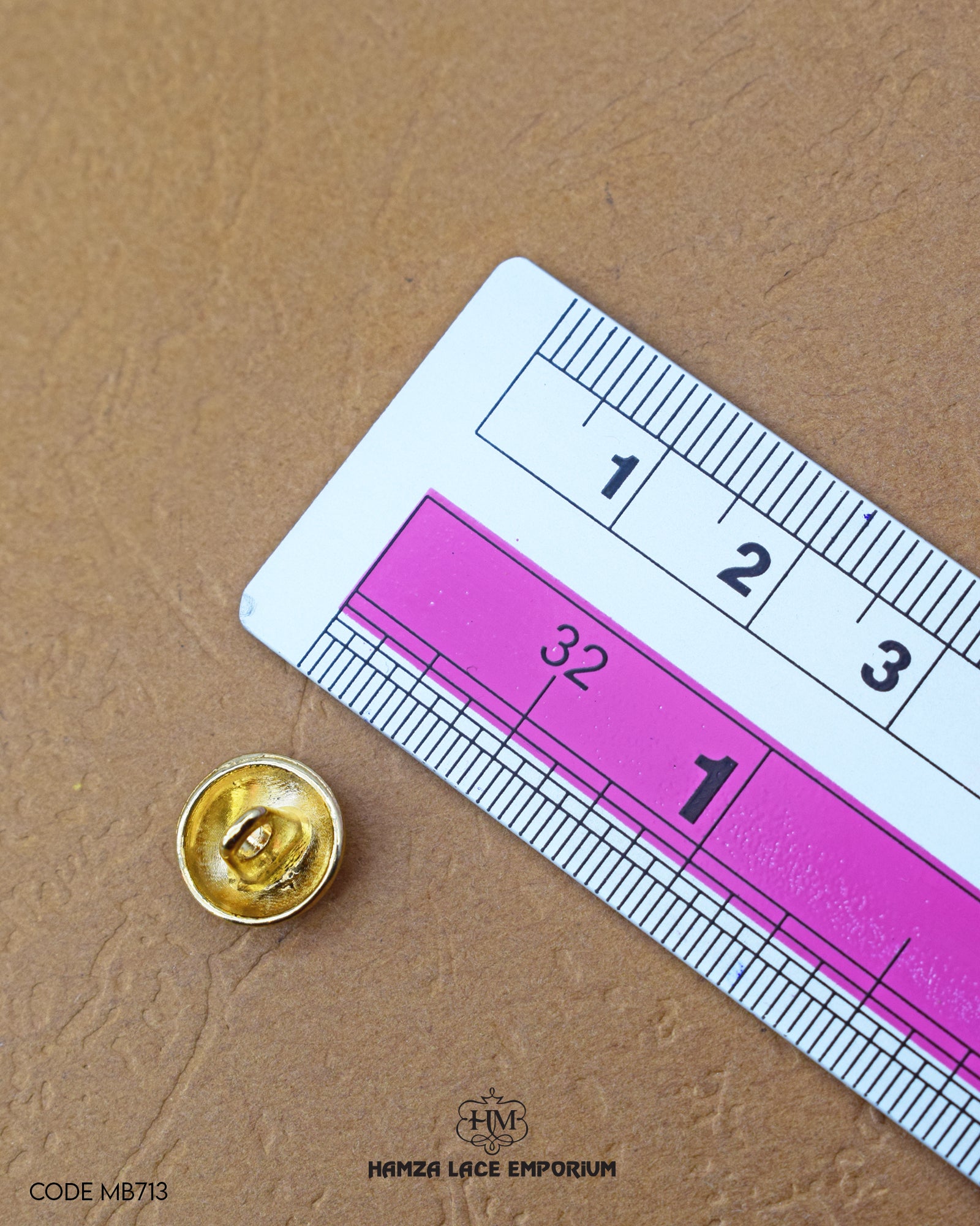 The size of the 'Golden Metal Button MB713' is measured using a ruler.