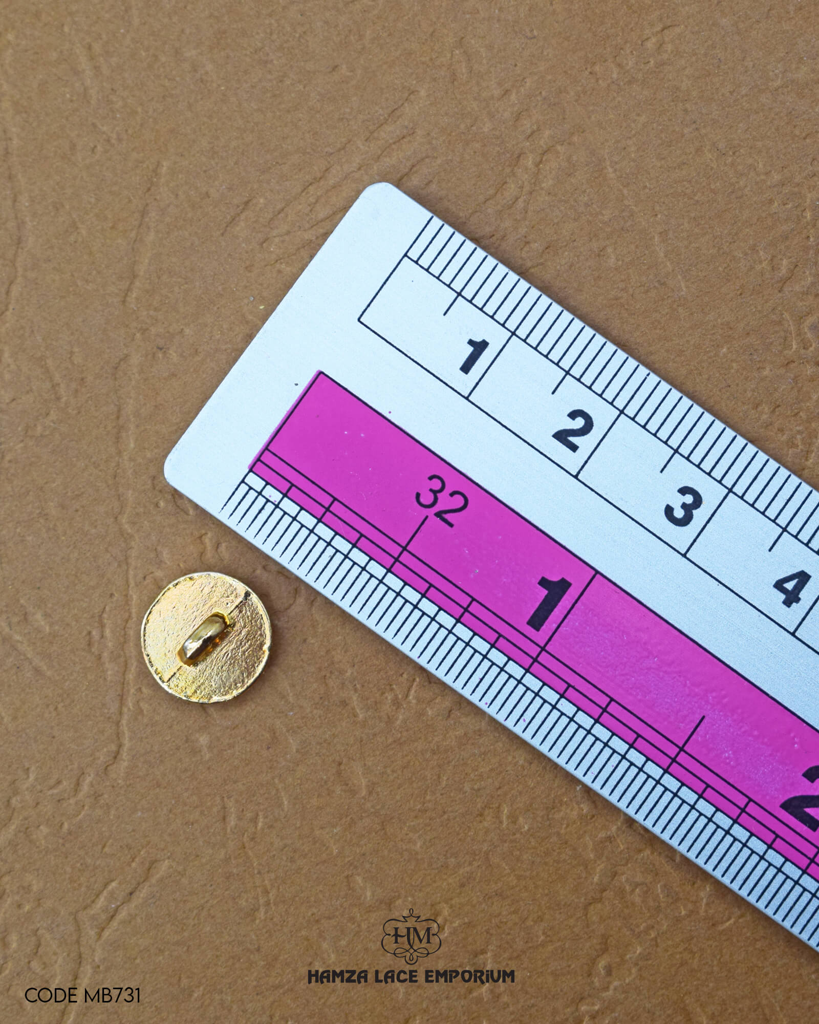 The size of the 'Golden Metal Button MB731' is measured by using a ruler