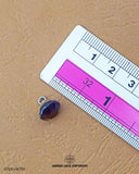 The size of the 'Metal Suiting Button MB799' is measured using a ruler.