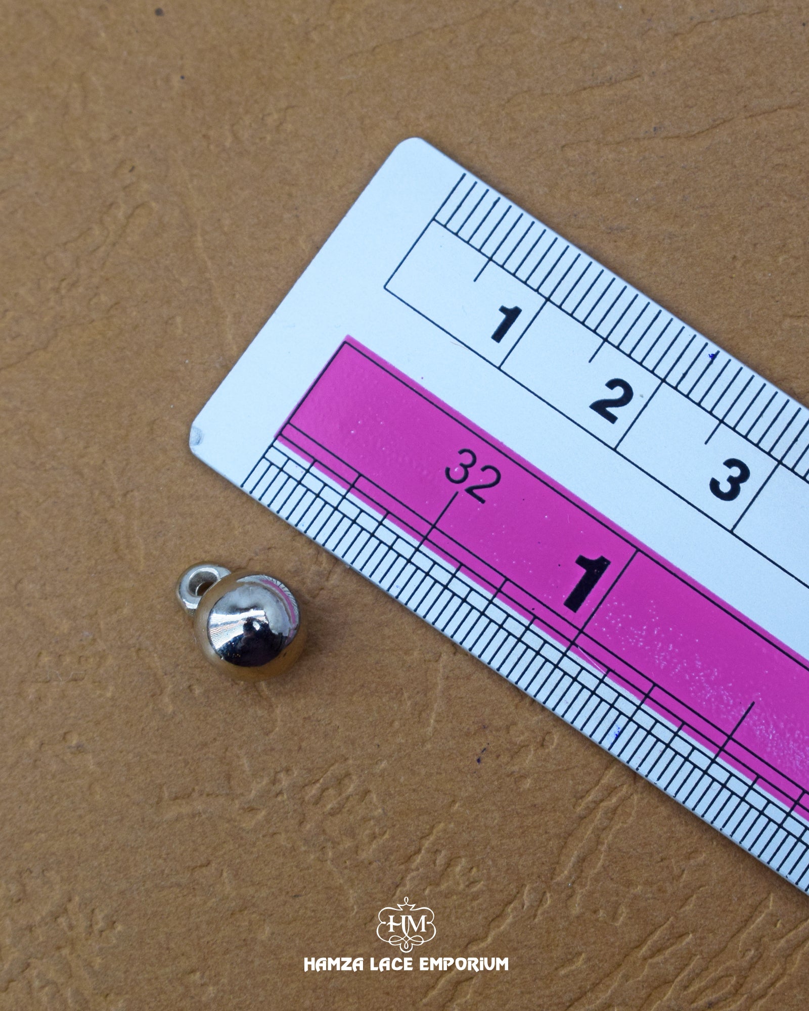 The size of the 'Metal Button MB802' is measured using a ruler.