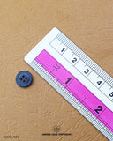 The dimensions of the 'Black Metal Button MB831' are determined using a ruler.