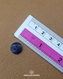 The dimensions of the 'Two Hole Button MB836' are determined using a ruler.