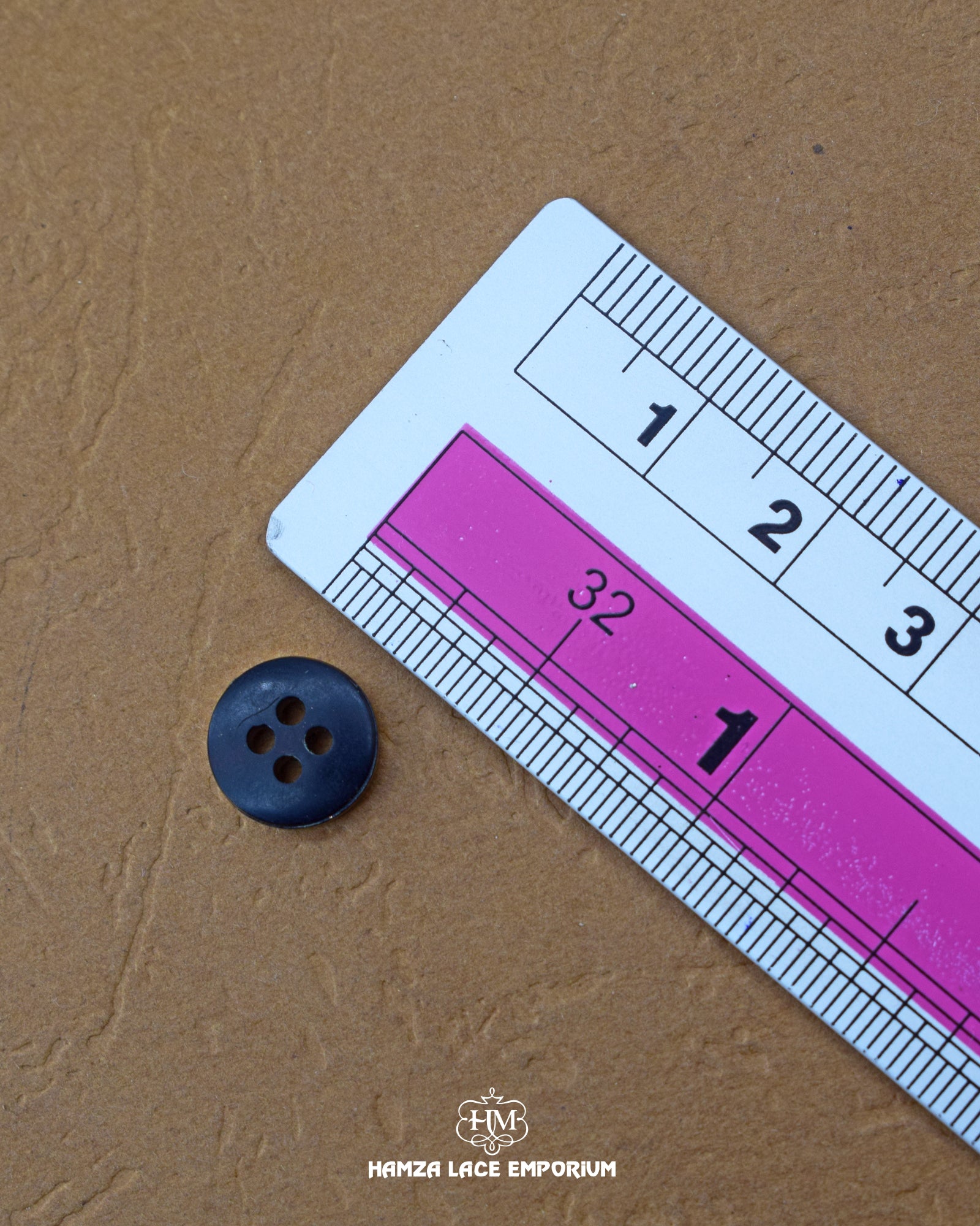 The size of the 'Four Hole Plastic Button MB839' is measured using a ruler.