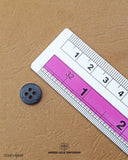 The size of the 'Four Hole Button MB849' is measured using a ruler.