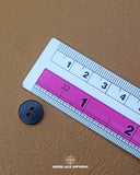 The dimensions of the 'Golden Button MB850' are determined using a ruler.