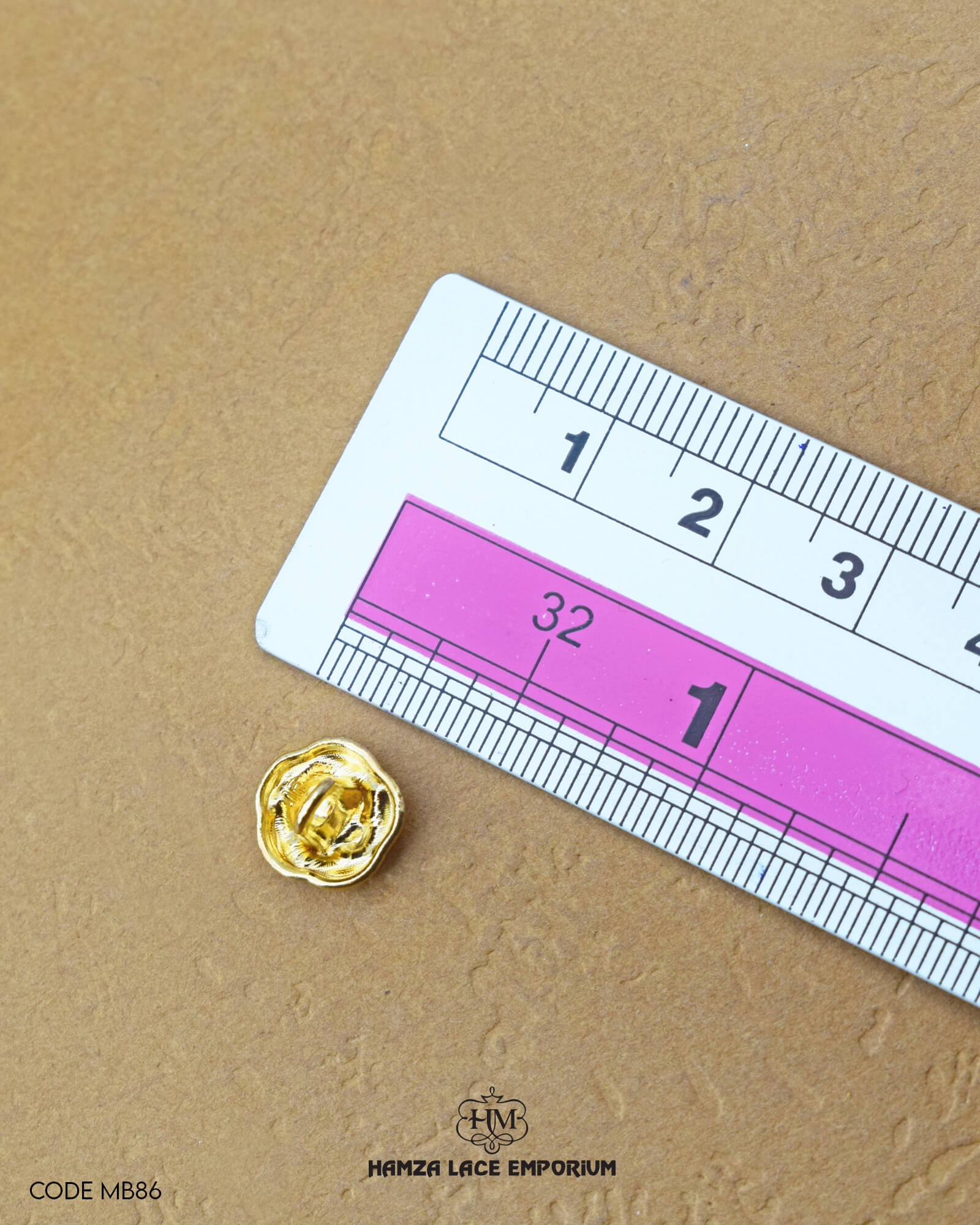 Size of the 'Flower Design Button MB86' is given with the help of a ruler