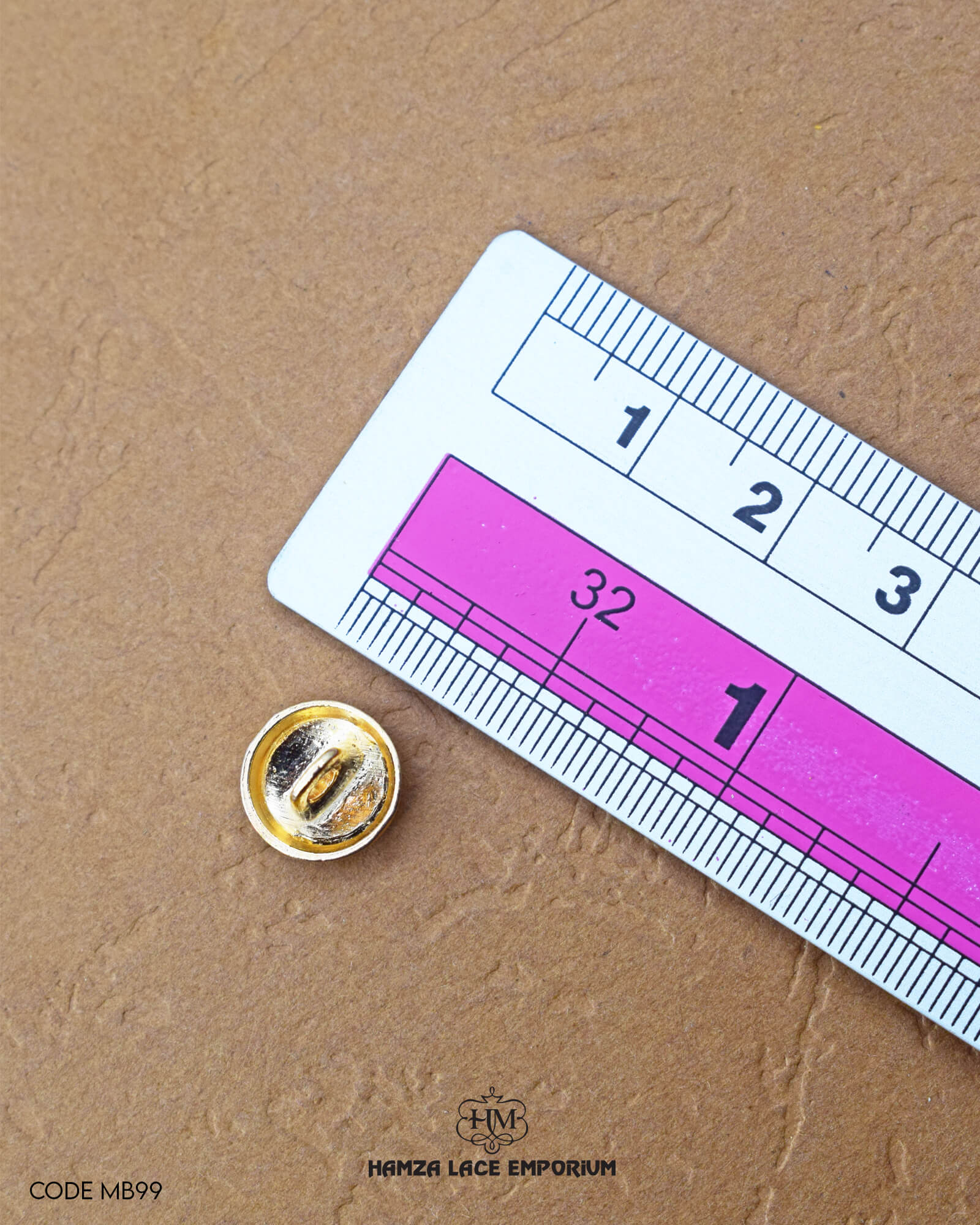 The size of the 'Golden Metal Button MB99' is measured using a ruler.