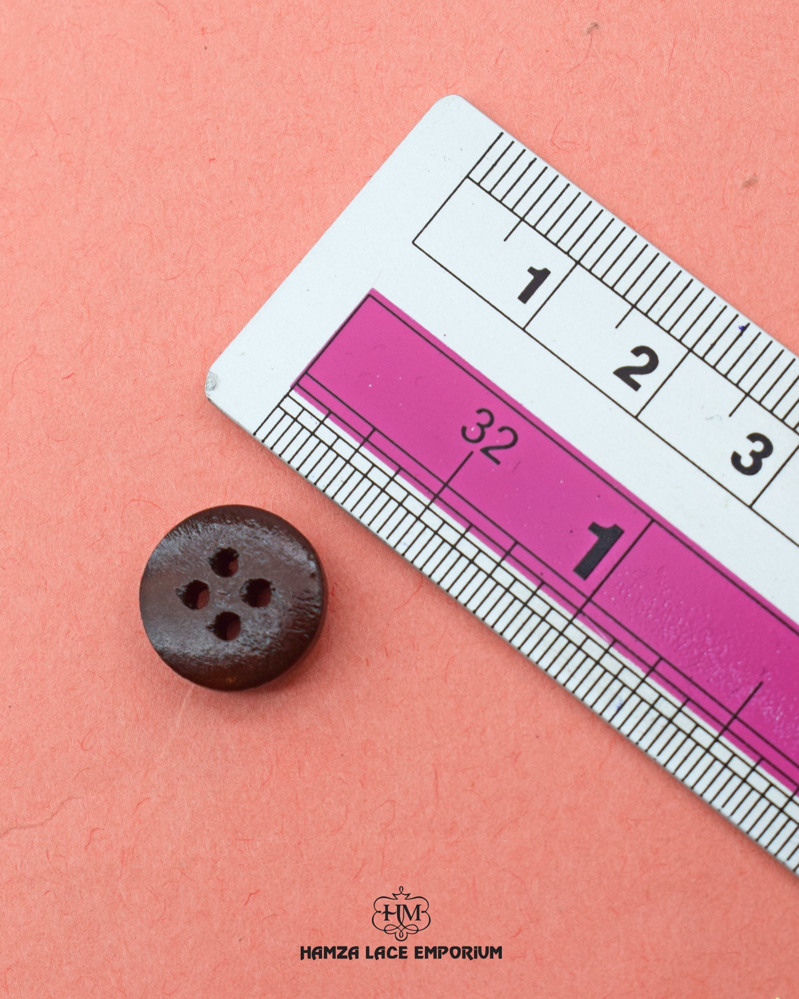 The size of the Beautifully designed 'Four Hole Wood Button WB109' is measured by using a ruler