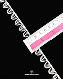 The 0.5 inches size of the white color 'Edging Shuttle Lace 70735'  is shown by placing a ruler on the product