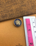 The size of the 'Metal Suiting Button MB112' is measured using a ruler.