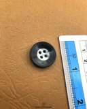 The size of the Beautifully designed 'Black Plastic Button PB006' is measured by using a ruler
