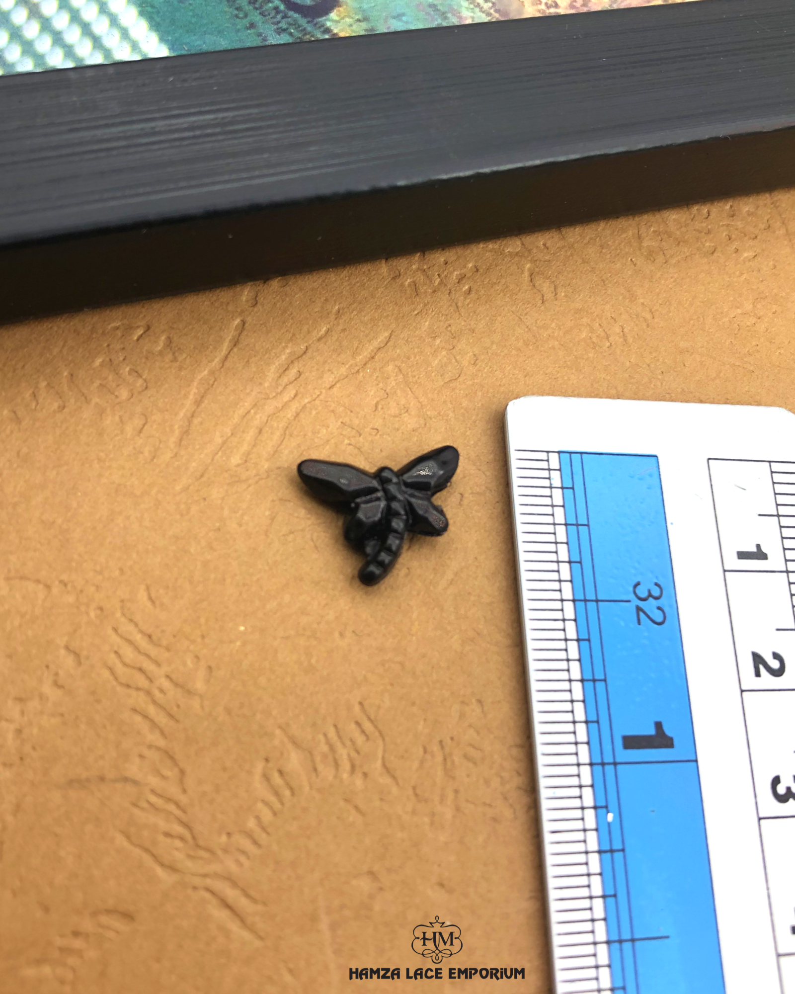 The size of the Beautifully designed 'Butterfly Shape Plastic Accessory PB117' is measured by using a ruler